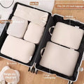 Travel packing cubes laid flat showing capacity