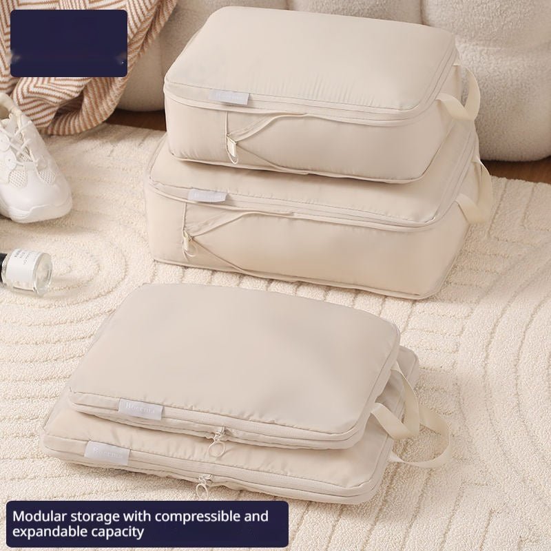 Packing cubes set in use inside open suitcase